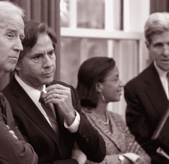 President Joe Biden standing with US Special Presidential Envoy for Climate John Kerry