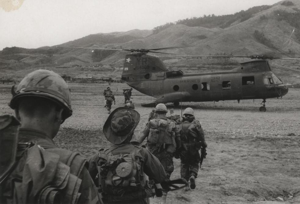 Marines boarding a transport helicopter during the Vietnam War.