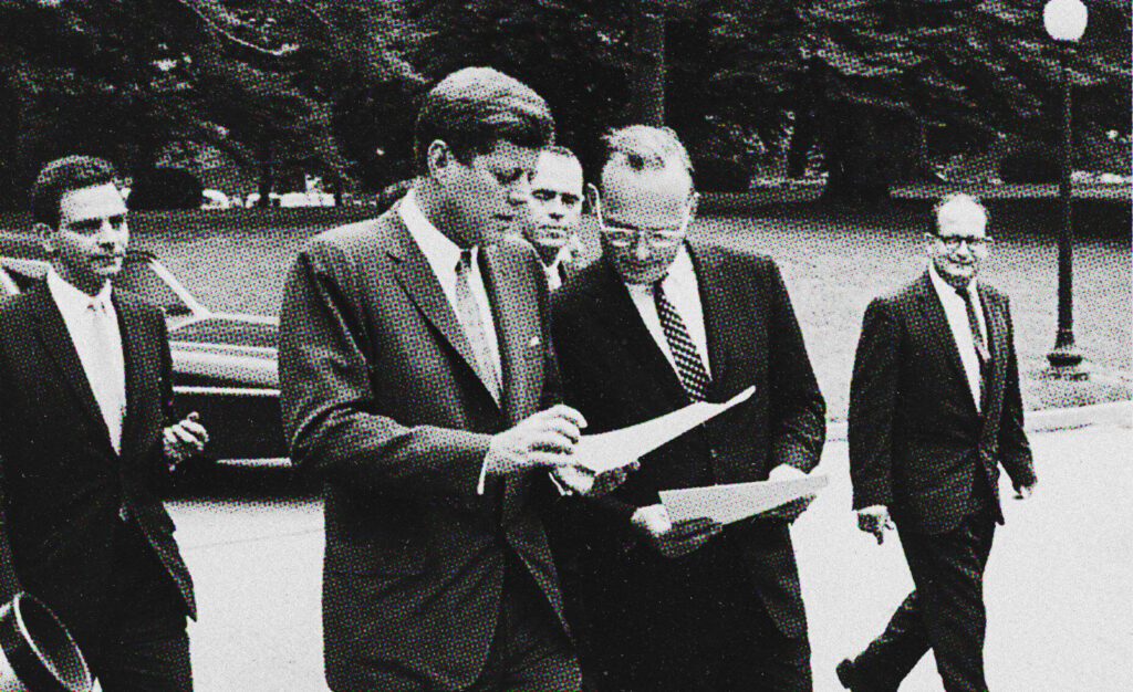 President John F. Kennedy walks with his national security adviser, McGeorge Bundy.
