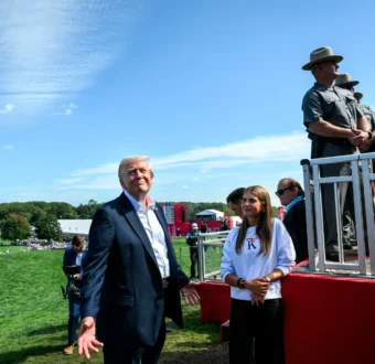 Trump basks in sunlight and applause beside his eldest grandchild, Kai Trump.