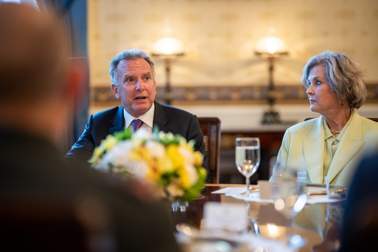Trump adviser Steve Witkoff and Chief of Staff Susie Wiles sit at a table.