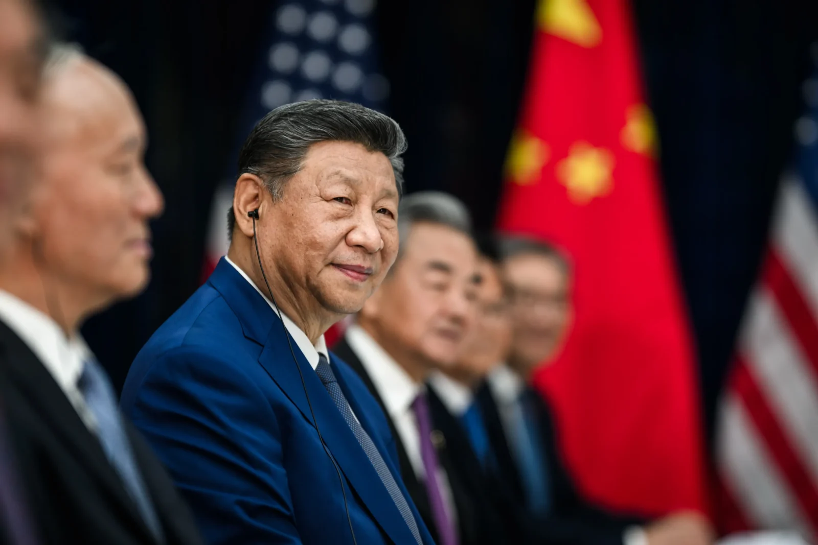 Chinese President Xi Jinping sits with his aides amid a meeting with US President Donald Trump.