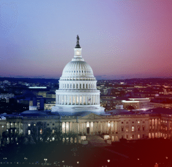 The US Capitol building viewed at night.
