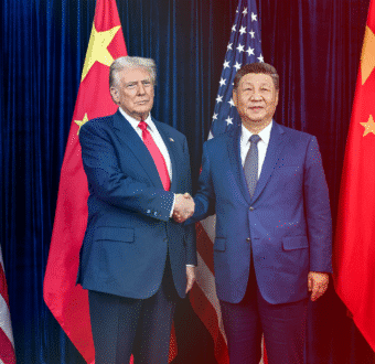 President Trump shakes hands with Chinese President Xi Jinping, standing in front of both countries' flags.