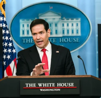 Secretary of State Marco Rubio addresses the press from a podium at the White House.